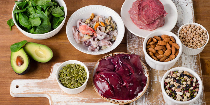 a group of bowls holding natural ingredients that are high in zinc