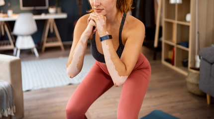 Woman Doing Squats in her Loungeroom