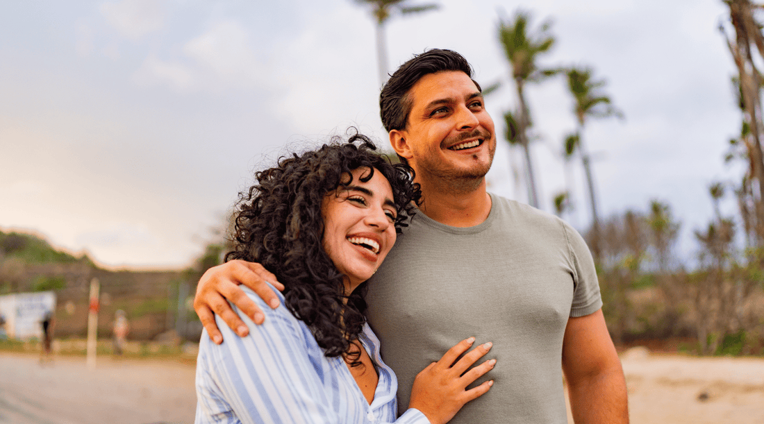 Couple on the beach living a healthy relaxing lifestyle