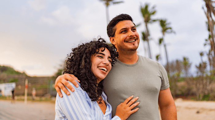Couple on the beach living a healthy relaxing lifestyle