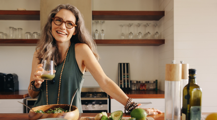 Older woman eating and drinking gut health enhancing recipes