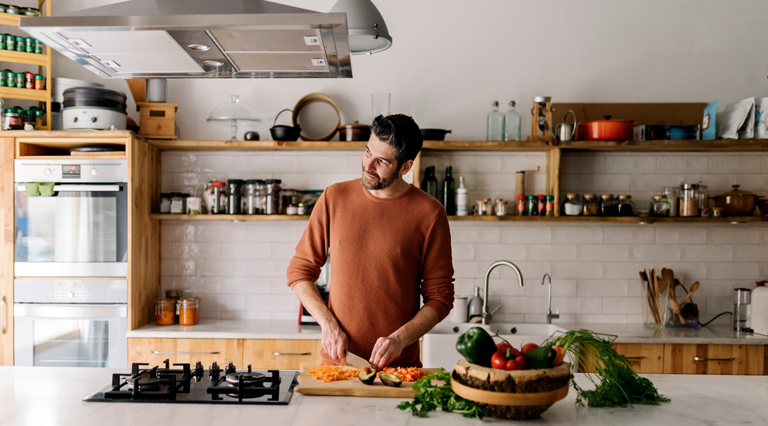 Man preparing gut-healthy enhancing meals in natural light