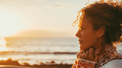 Woman in her mid-forties by the beach