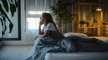 Woman in bed stressing