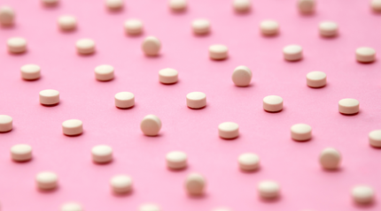 Mini Estrovera Tablet on Pink Background