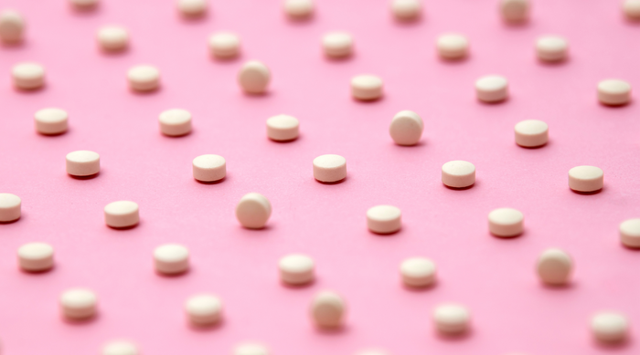 Mini Estrovera Tablet on Pink Background