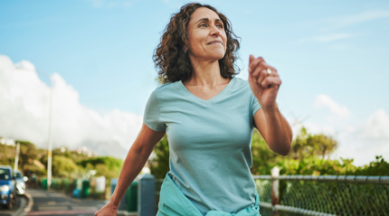 Woman Happily Walking in Nature