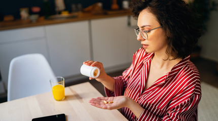 Woman taking iron supplements