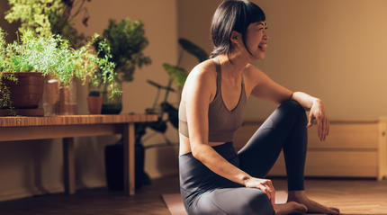 Health concious woman in natural light yoga studio