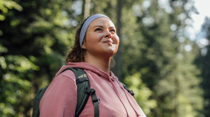 Health concious woman hiking in the forest
