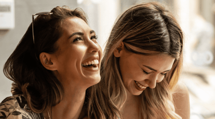 Two women together enjoying laughter and a healthy lifestyle