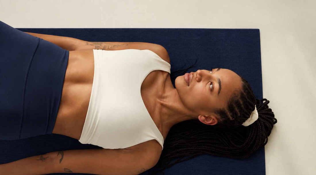 Woman lying on a yoga mat 