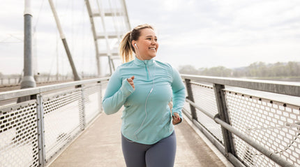Woman is running across a bridge boardwalk