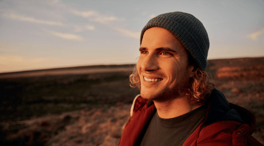Close-up of a man’s face, looking healthy and relaxed, used to represent men’s health and the role of vitamins in overall wellbeing