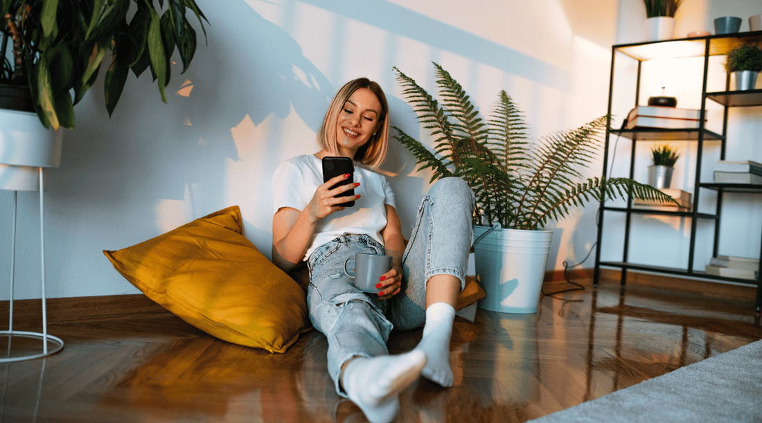 A woman is reading on her mobile phone