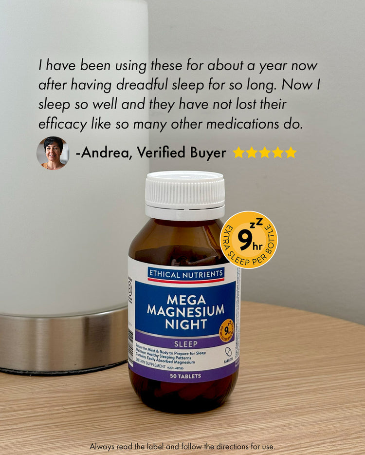 Bottle of Ethical Nutrients Mega Magnesium Night tablets on a wooden surface next to a lamp. Label highlights sleep support with magnesium glycinate and passionflower. Text above the product shows a verified buyer review praising improved sleep quality and lasting effectiveness.